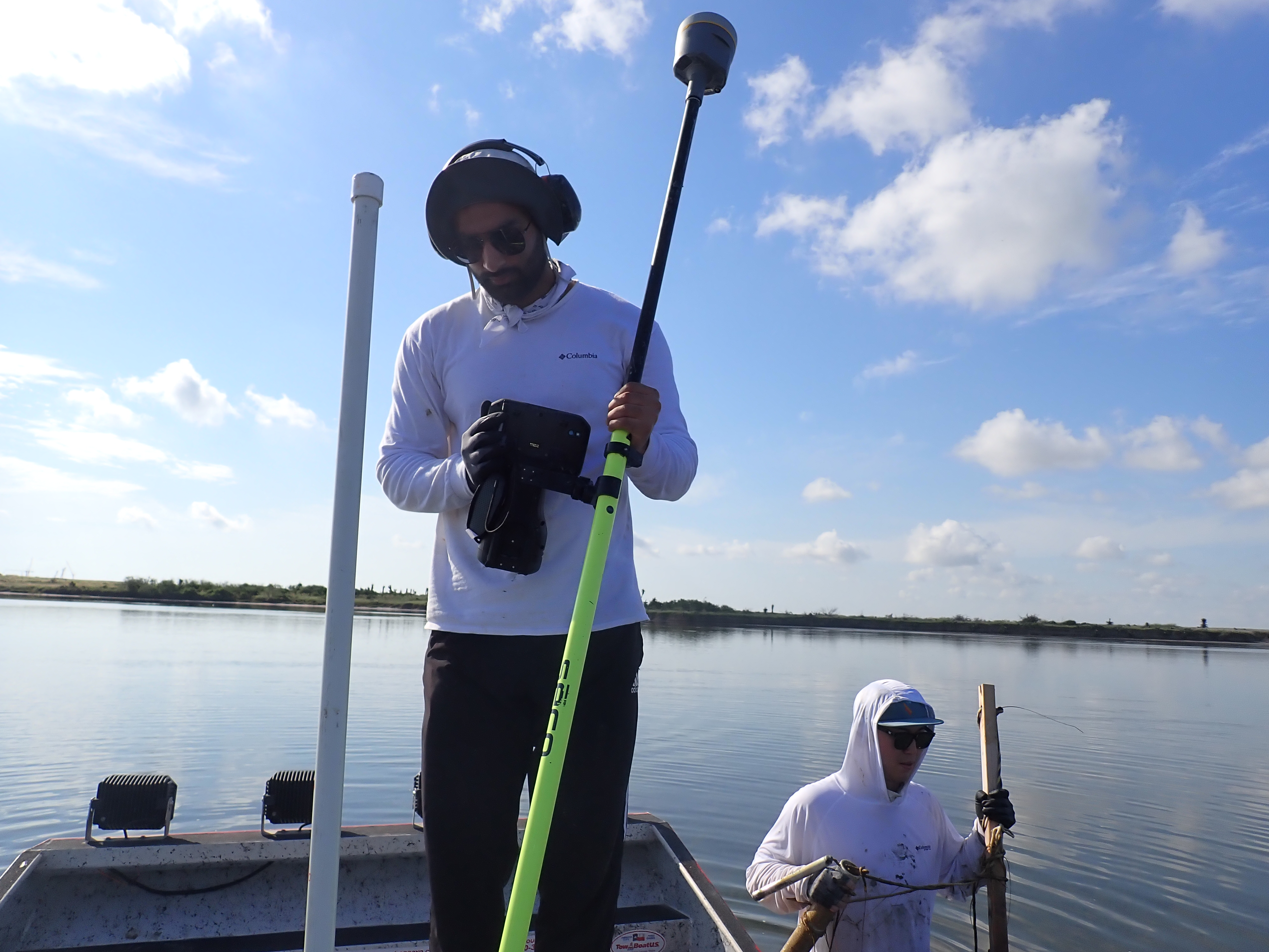 Field researchers collecting measurements at Bahia Grande in South Texas